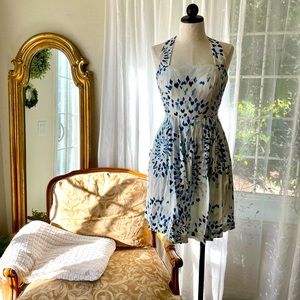 Vintage inspired white and blue asymmetric print dress.